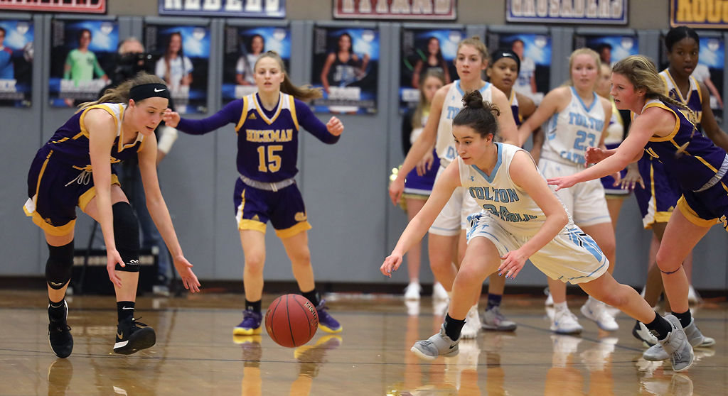 Ella Rogers and Sophia Elfrink reach for a loose ball